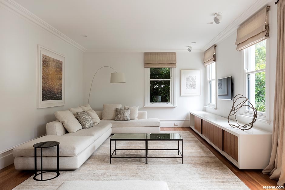 Cool neutral walls make this lounge feel larger