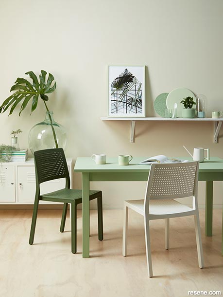 A dining room with green accents