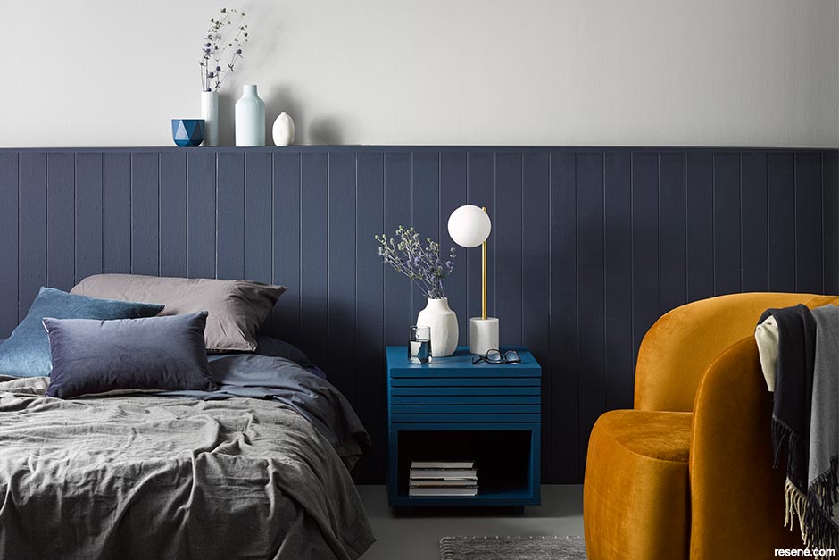 A navy + mustard + turquoise + charcoal bedroom