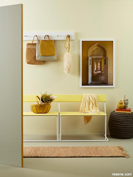 A happy pale yellow home entryway