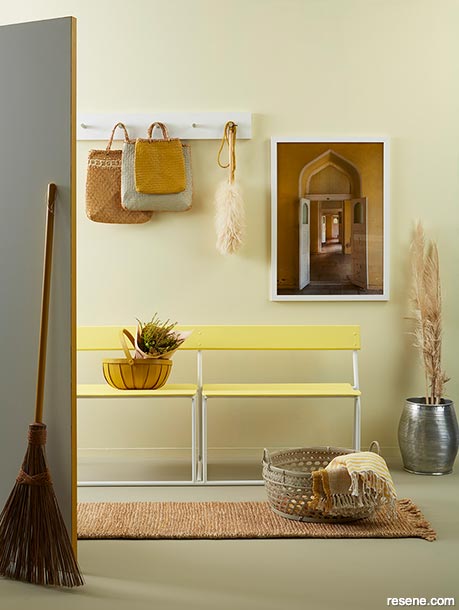 A soft yellow home entryway