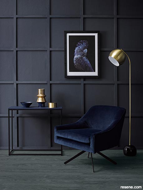 A dark interior with walls in a grid format