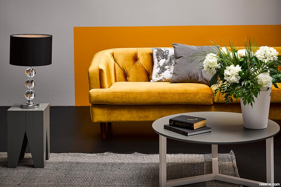 A lounge with classic Resene neutrals and a yellow colour block on wall