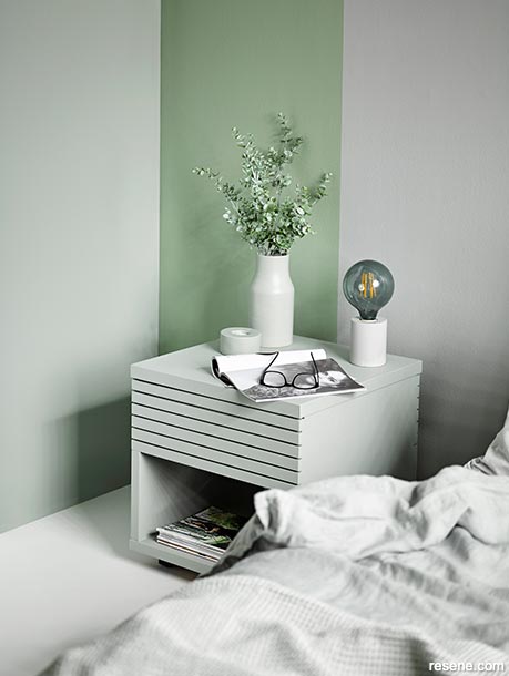A soft green and silver bedroom