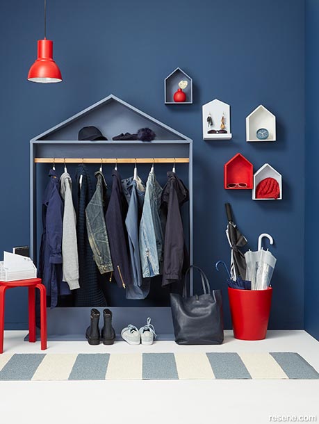 A sophisticated navy mudroom