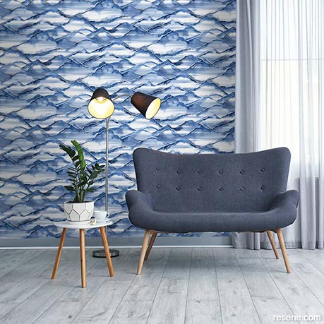 A lounge with denim blue wallpaper