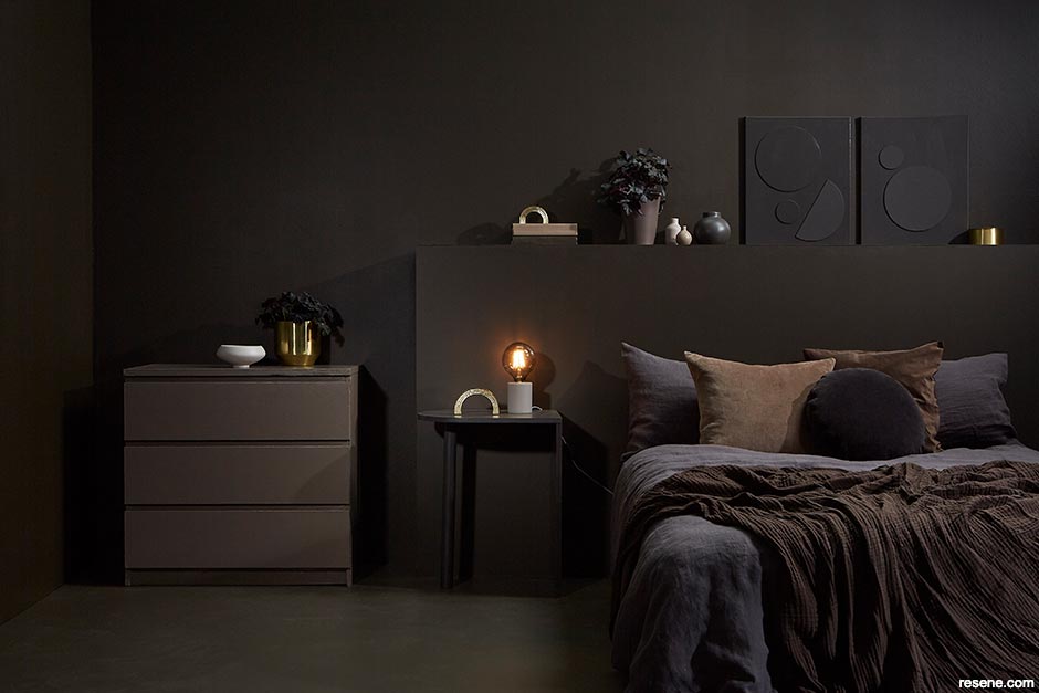 A bedroom painted in chocolate tones