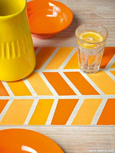 Painting a colourful chevron table runner