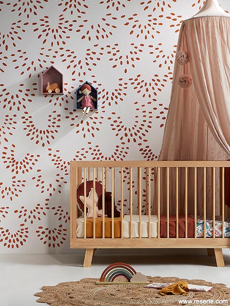 A nursery with an irregular dot pattern on the walls