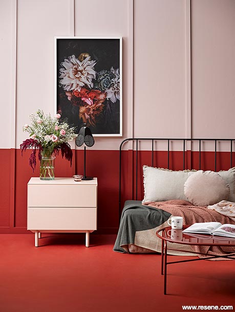 A room divided by red and pink paint colours