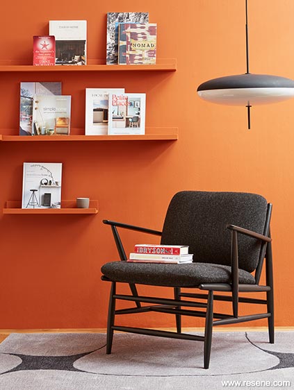 An orange sitting room with orange shelves