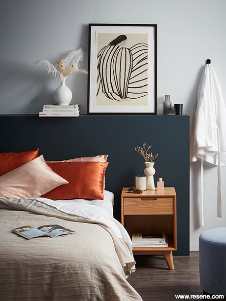 A master bedroom with dark and light blues