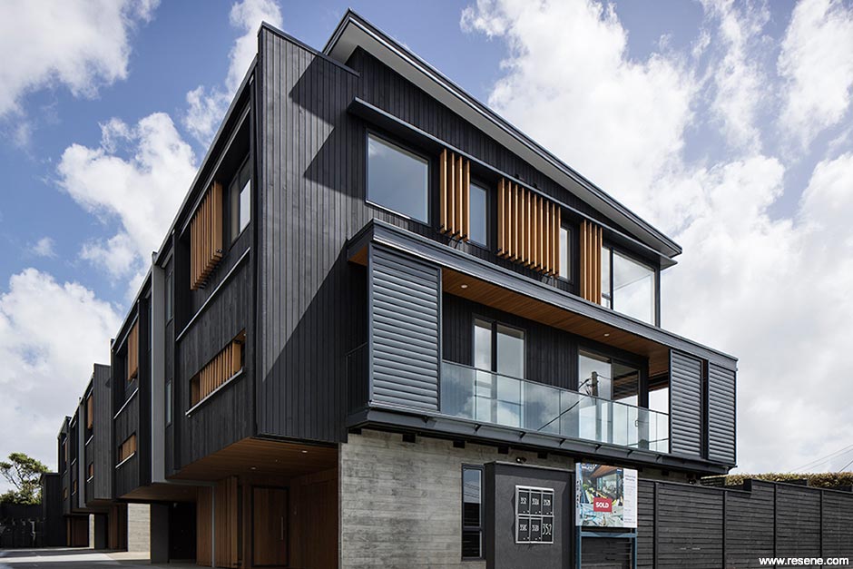 A stained black home exterior