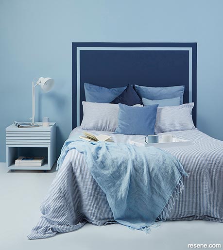 A blue bedroom with conductive paint
