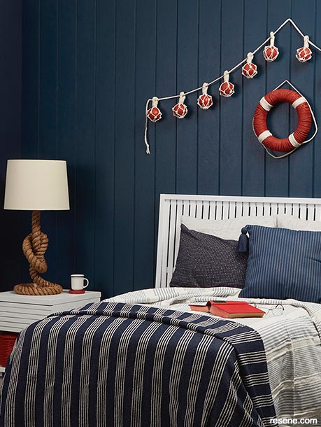 A blue nautical themed bedroom