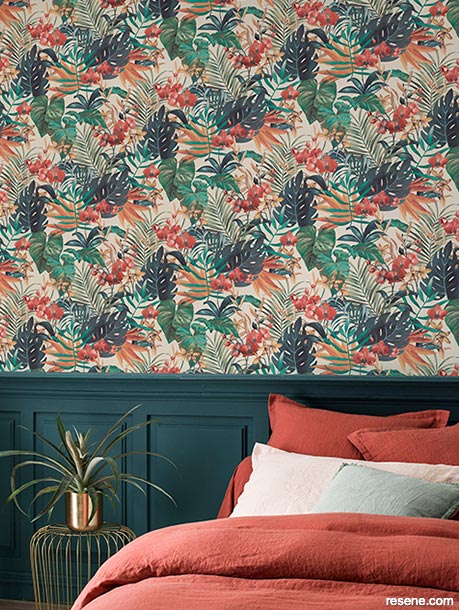 A bedroom with botanical wallpaper