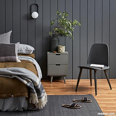 A charcoal grey bedroom