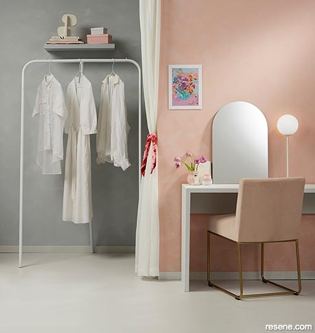 A pink and grey walk-in wardrobe