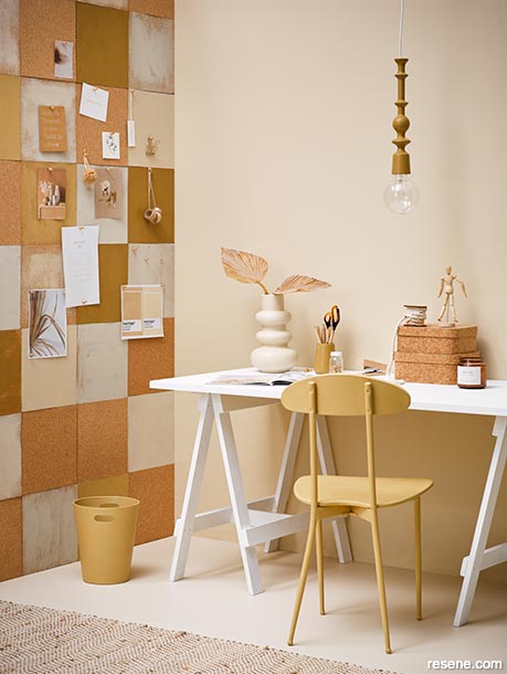 A home office with painted cork tiles