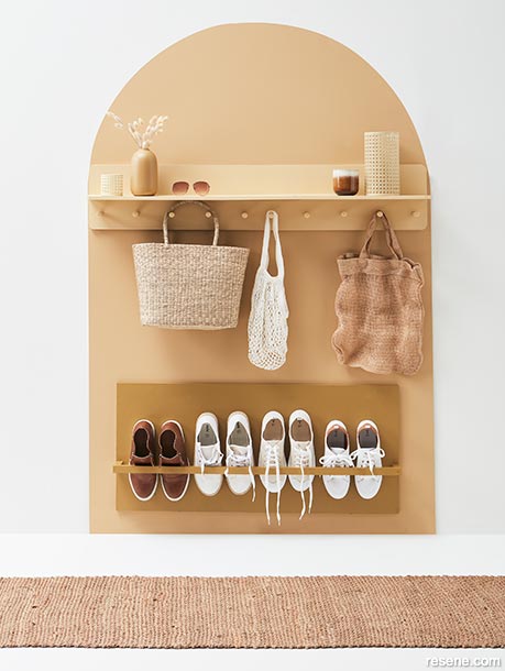 A mudroom with a contrasting arch and matching shelves