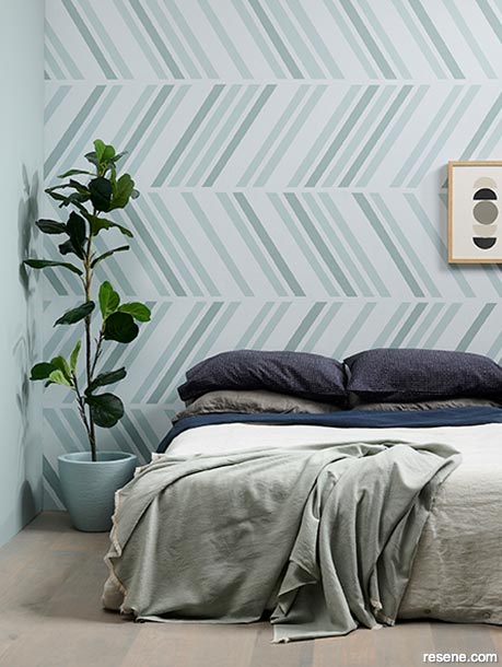 A bedroom with a soft colour palette in a dynamic zig zag pattern