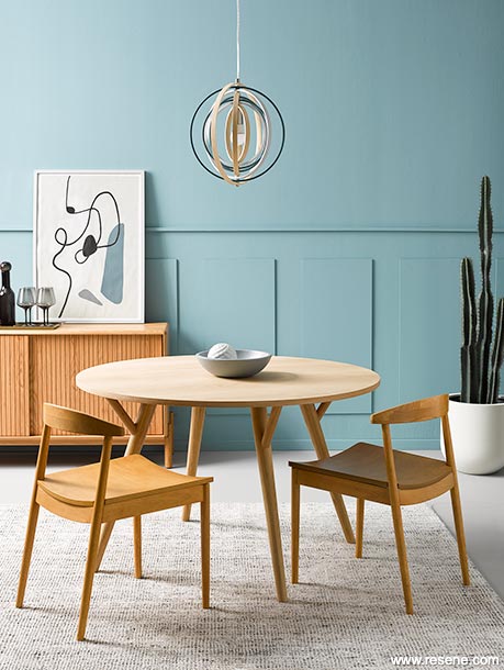 A blue dining room with panelling