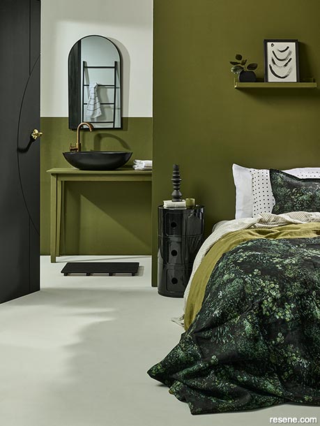A sophisticated olive green master bedroom and ensuite
