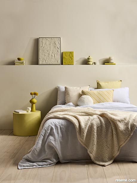 A yellow toned bedroom with bright yellow accessories