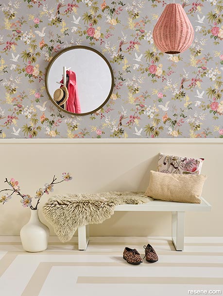 A hallway decorated with floral wallpaper