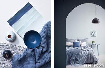 Pale blue bedroom with dramatic contrasting dark arch doorway