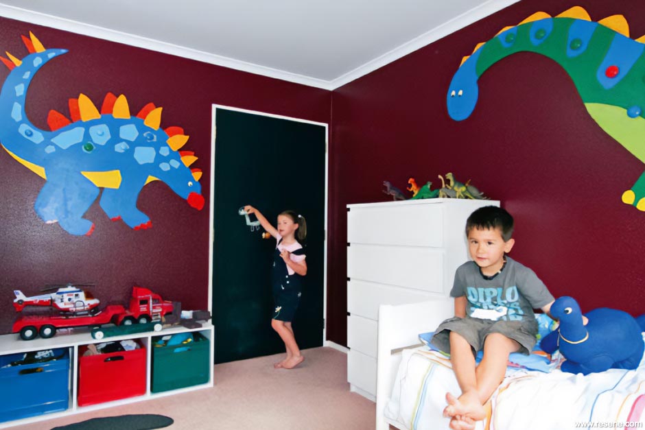 A dinosaur themed kids bedroom
