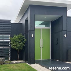 A colourful green front door in Resene Koru