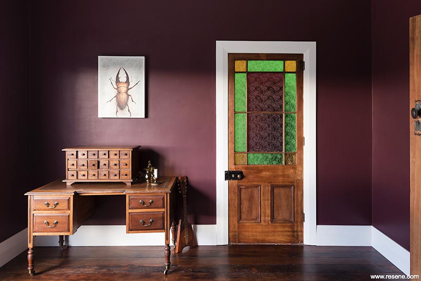 Entryway in bold colour and stained glass