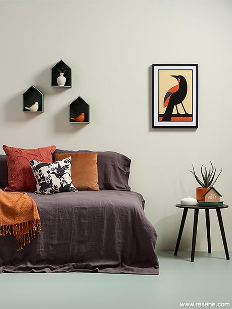 A tı̄eke artwork sets the bedroom colour scheme