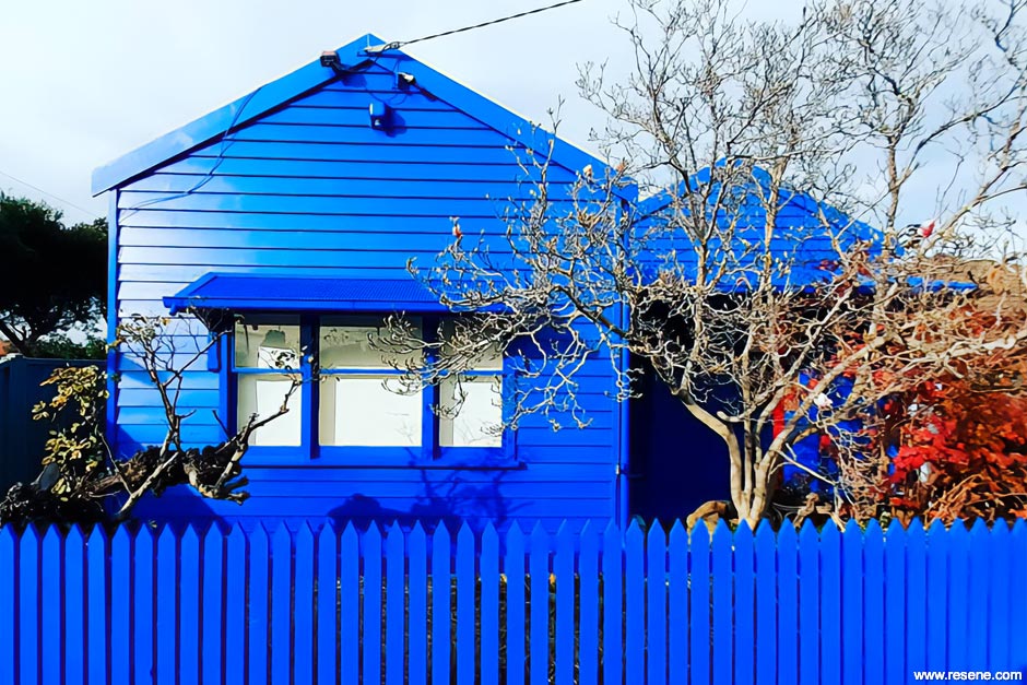 A bright blue home exterior
