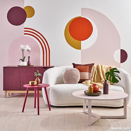 A lounge with a mural - red arches, circles and curves
