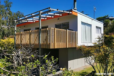 A freshly painted orange and white home exterior