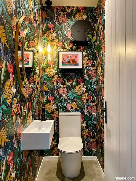 Fun and tropical wallpaper in the powder room