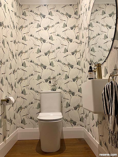 A fun wallpaper pattern in a California bungalow bathroom