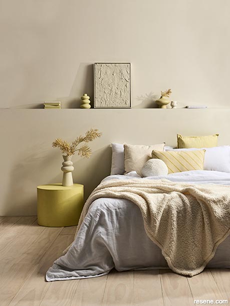 A bedroom with lemon curd yellow accents