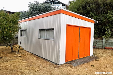 An orange and white garage exterior