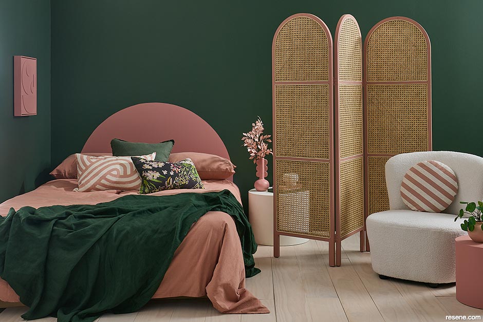 A cohesive pink and green bedroom 