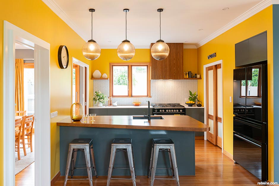 A dramatic yellow kitchen