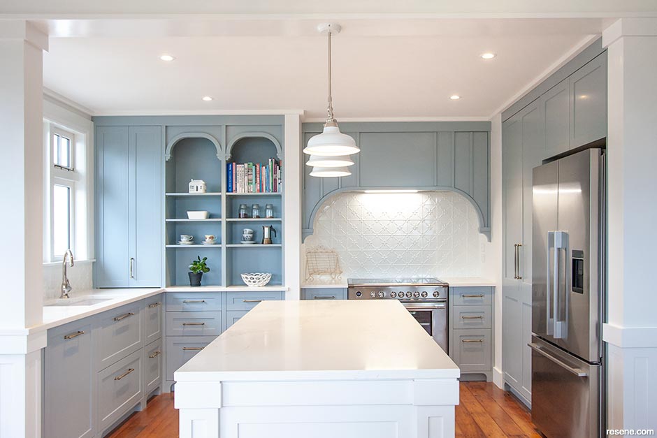 A heritage kitchen with a painted pressed tin splashback