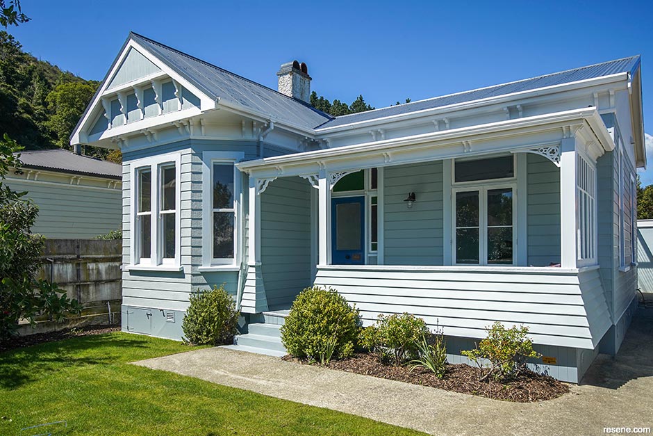 An updated blue/green villa exterior using Resene Half Inside Back