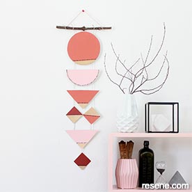 Geometric painted wall hanging