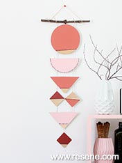 Geometric painted wall hanging