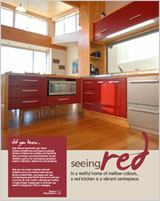In a restful home of mellow colours, a red kitchen is a vibrant centrepiece