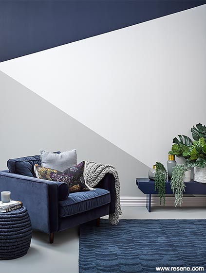 The feature of this living room is the triangular patterned wall