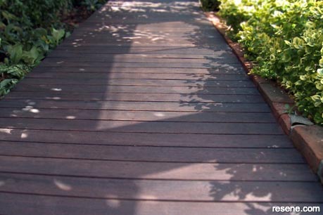A deck stained in Resene Tamarind